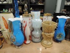 An assortment of vintage glass and ceramic vases,predominantly mid century.