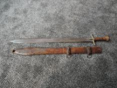 A Sudanese Sword (kaskara) possibly 19th century with flat double edge blade, heavily etched,