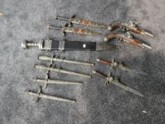 A collection of reproduction Daggers and Flintlock Pistols, Roman Short Sword with scabbard, two