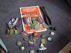 A collection of Militaria including WW2 Medals Star, Defence & War, Buttons, Cloth Badge for