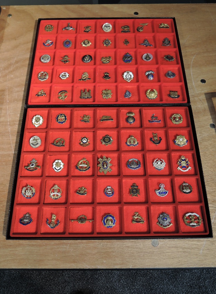 Two display trays containing Seventy Sweetheart Brooches including Royal Navy, Kings Own,