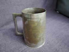 A WWII trench art silver plated tankard, engraved with a map and details of the North Africa
