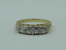 A five stone diamond chip dress ring having scrolled gallery mount on 9ct gold loop, size Q & approx