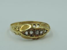 An 18ct gold band ring having 5 diamond chips in shaped mount, size R & approx 2.1g