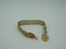 A 9ct gold fancy link articulated cuff bracelet having padlock clasp, approx 27g