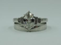 A diamond solitiare dress ring having a marquise cut diamond, approx 0.85ct in a claw set mount to