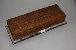 An Indonesian smokers humidor or glove box having detailed scene of mythology with cobra and