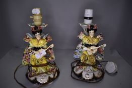 A pair of kitsch mid century lamp bases in the form of two geisha