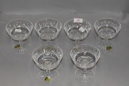 A set of six clear cut crystal champagne glasses by Waterford in the Lismore design