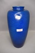 A studio pottery vase by Royal Lancastrian having a deep blue two tone glaze approx 40cm tall