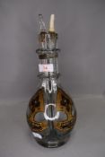 A vintage ships style four compartment spirit decanter with original labels