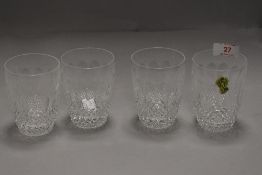 A set of four clear cut crystal tumbler glasses by Waterford