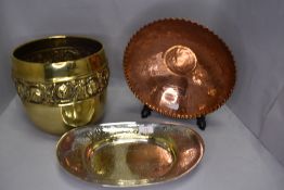 A selection of metal wares including copper African bowl and brass embossed planter