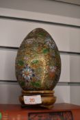 A large Chinese cloisonné egg having incised decoration.