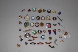 A selection of enamel pin badges including walking cycling and scouts interest