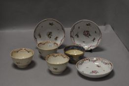 A small selection of 19th century Newhall porcelain teabowls and saucers and one blue and white