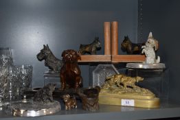 An interesting selection of dog related items including bronze head and wooden bulldog and Scottie