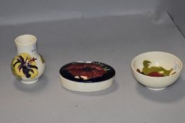 A group of three Moorcroft Pottery items, comprising baluster vase, bowl and trinket box, tube-lined