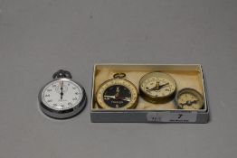 A Precista chromed pocket stopwatch, together with three pocket compasses.