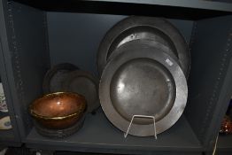 A selection of antique pewter plates and large chargers approx fifteen in total some bearing touch