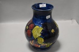 A Moorcroft pottery baluster vase, tube-lined in the Clematis pattern, painted and impressed marks