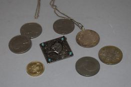 A small collection of mixed commemorative coinage and Egyptian design pendant