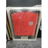 A framed England Shirt, World Cup Winners 1966, bearing signatures, Geoff Hurst, Alan Ball, Roger