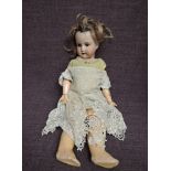 An early 20th century Heubach Koppelsdorf bisque headed doll having sleep blue eyes, open mouth with