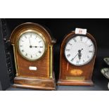 An early 20th century inlaid mahogany mantel clock with brass pillars, Arabic hours and applied