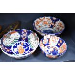 A group of three 20th century Japanese Imari porcelain bowls, of traditional design and decoration