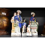 A group of three Staffordshire pottery style figures and one Chinese figure