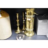 An early 20th century cylindrical brass companion stand, a pair of brass candlesticks and silver