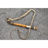 A 20th century bamboo, plaited leather, carved antler and wire-bound bull whip with whistle to
