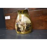 A small porcelain beaker being hand decorated with scene of a cherub signed A Dagoty Paris (handle