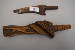 Two antique carved distaffs.