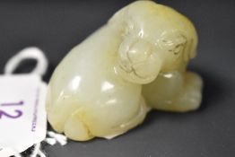 A Chinese Sun jade carving depicting dog.