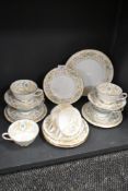 A collection of Tuscan 'Versailles' cups,saucers and plates having white ground, gilt pattern and