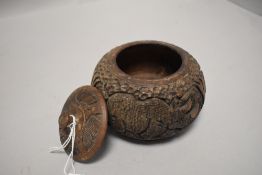 A Carved hard wood African lidded jar.