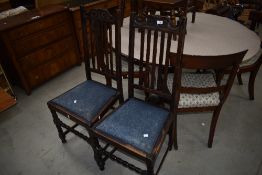 A pair of early 20th Century oak railback dining chairs