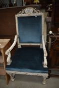 A Continental painted armchair in the French style with blue dralon upholstery