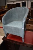 A vintage Lloyd Loom tub chair