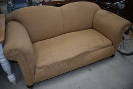 A traditonal Victorian style drop end settee having shaped back and tweed type upholstery , nice