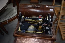 A traditional cased Singer sewing machine