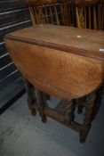 An early 20th Century oak twist gateleg occasional table