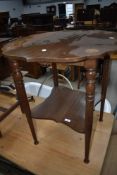 A late Victorian mahogany and inlaid table having shaped top