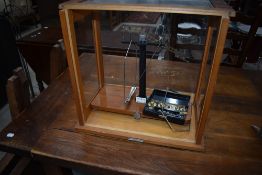 A set of traditional cased lab scales, named for Reynolds and Branson Ltd, Leeds