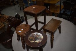 Three traditional stools and an occasional table