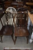 A set of four wheelback dining chairs , including one painted