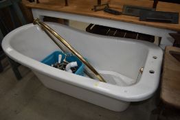 A modern slipper bath, as new, with fittings