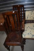 Two early 20th Century oak rail back dining chairs